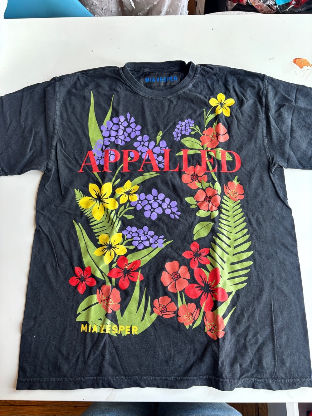 APPALLED Floral Graphic Tee in Black with Yellow, Purple, Red and Green Flowers